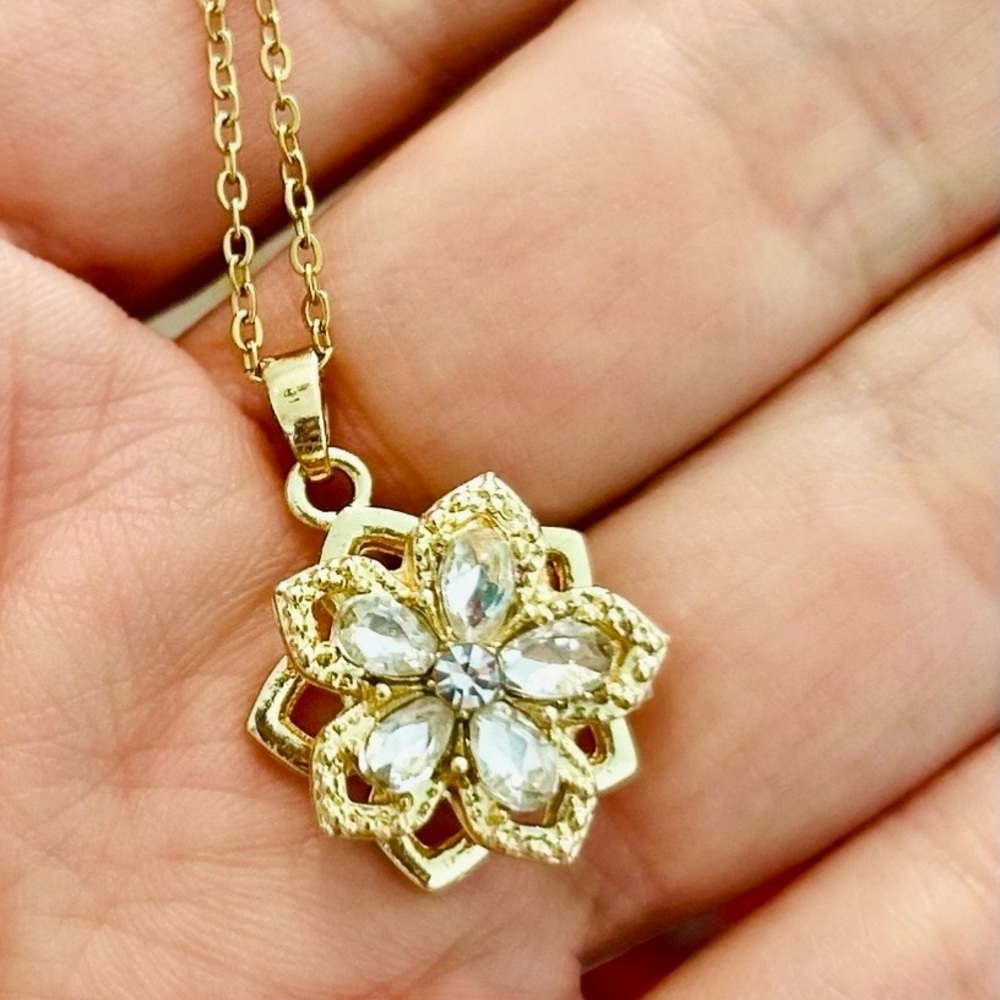 Gold plated flower pendant necklace with white zirconia gemstones